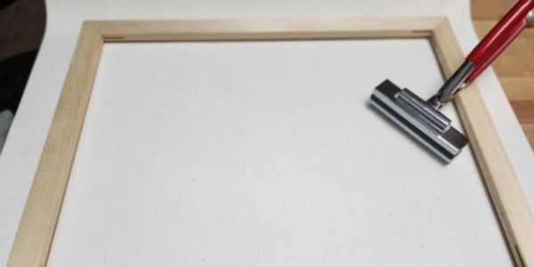 stretching canvas with canvas pliers
